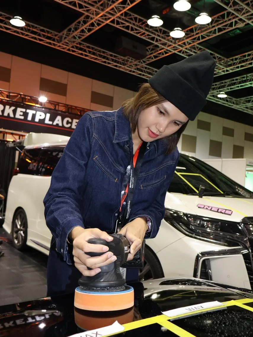 Nina machine-polishing a bonnet