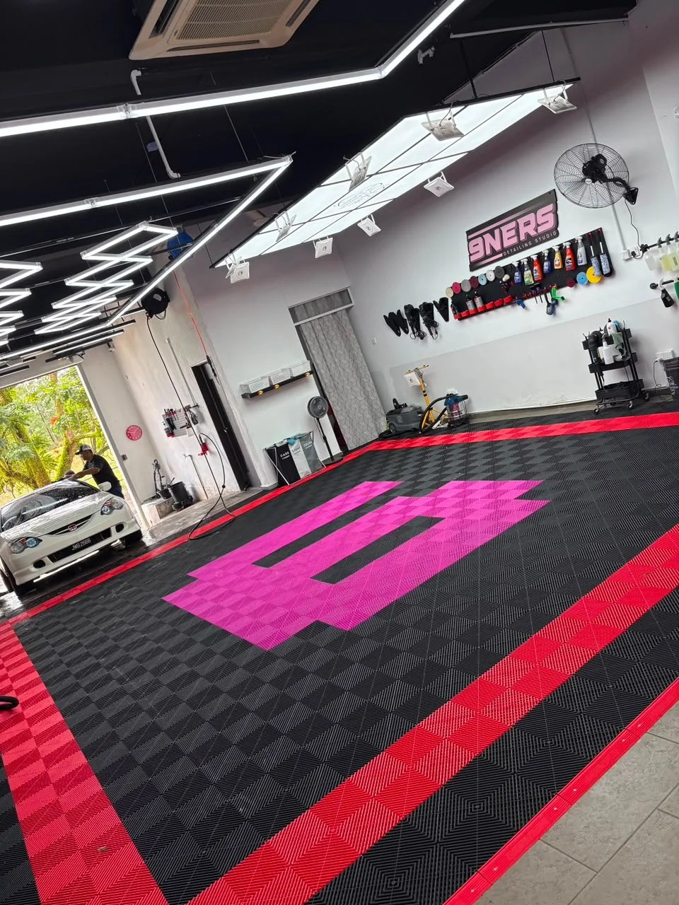 The 9NERS bay with the pink 9 on the checkered floor
