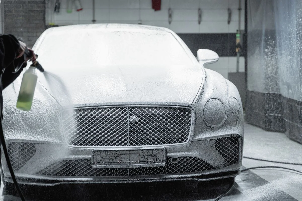 Car covered in thick wash foam
